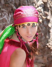 Wearing her pots fanny costume, Firebird's alluring belle stands out painless she bravely poses along the rocky cliff by the sea.