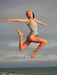 Uncompromisingly skinny with an increment of sporty teen jumping with an increment of flying naked in the first place the shore